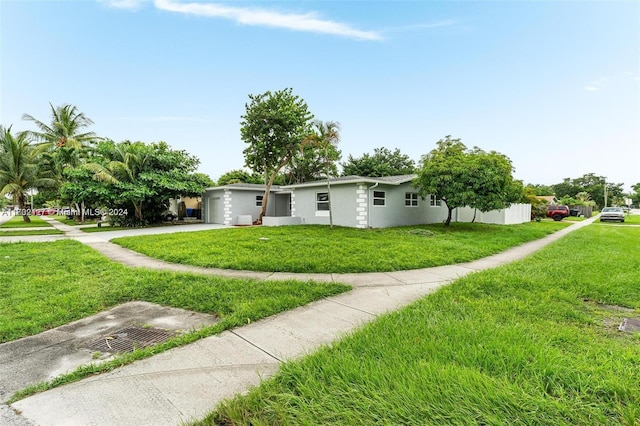 ranch-style home featuring a front yard