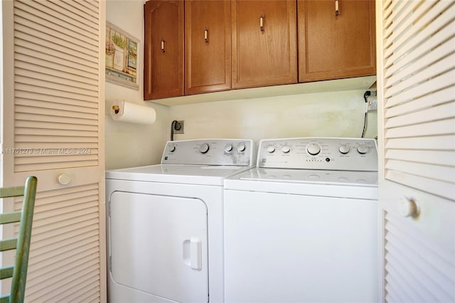 laundry area with cabinets and washer and dryer