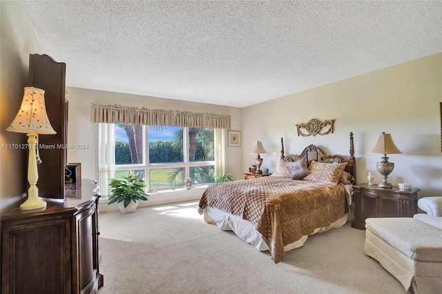 carpeted bedroom featuring a textured ceiling