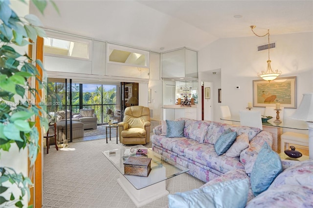 carpeted living room featuring lofted ceiling