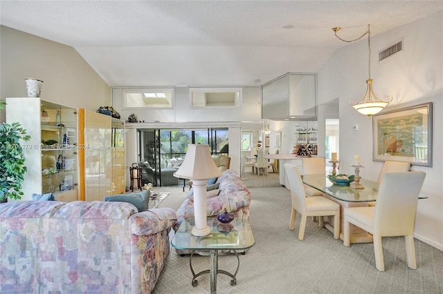 carpeted living room with lofted ceiling