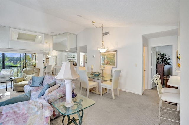 carpeted living room featuring high vaulted ceiling