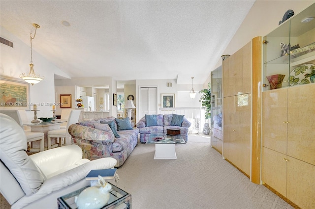 carpeted living room with lofted ceiling and a textured ceiling