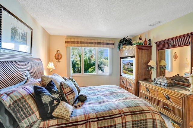 bedroom featuring a textured ceiling