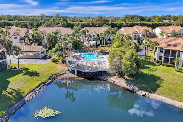 birds eye view of property with a water view