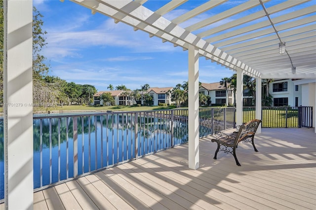 exterior space with a pergola and a water view