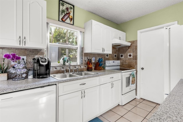 kitchen featuring white cabinets, white electric range, sink, dishwashing machine, and light tile patterned flooring