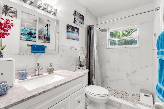 bathroom featuring a shower with curtain, vanity, tile walls, and toilet