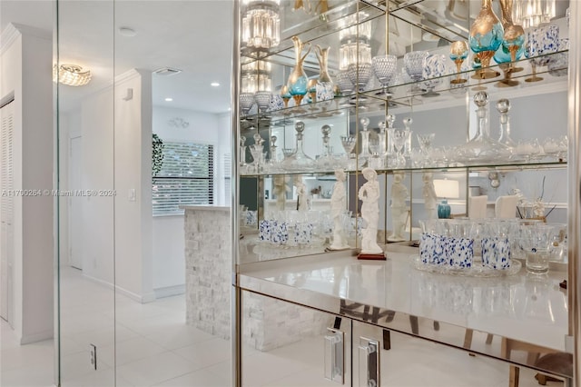 interior space featuring tile patterned flooring and crown molding