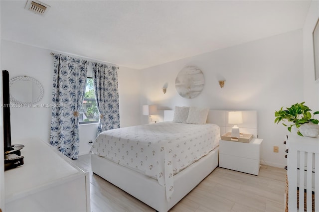 bedroom with light hardwood / wood-style flooring