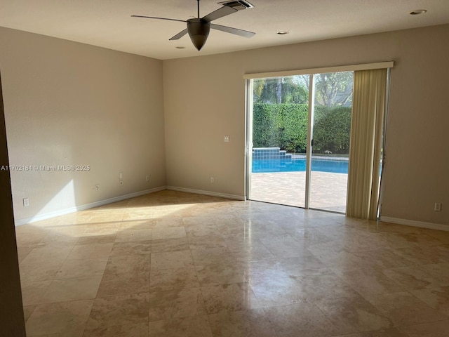 unfurnished room with ceiling fan