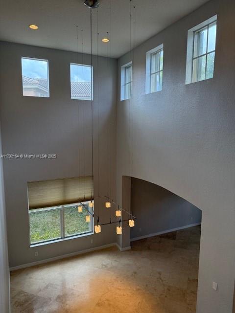 hallway featuring dark wood-type flooring, washer / dryer, and a textured ceiling