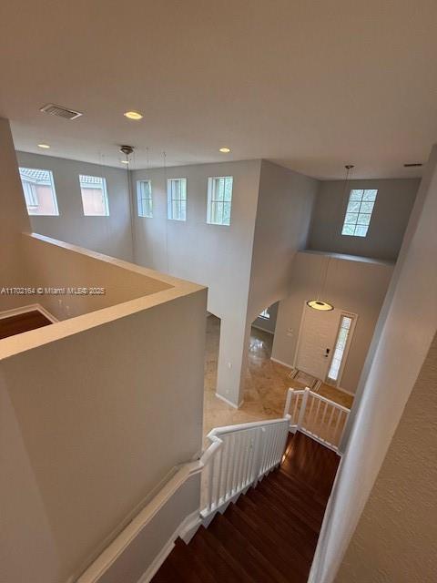 unfurnished room with dark hardwood / wood-style flooring