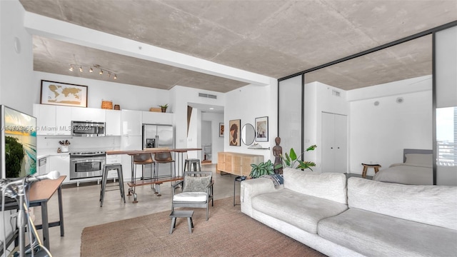 living room with concrete floors