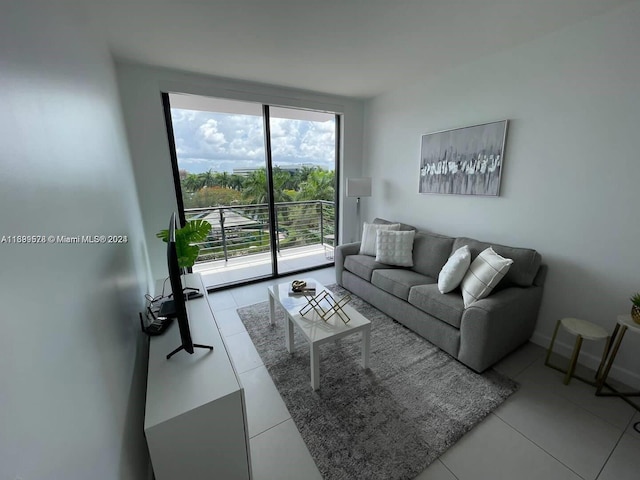 living room featuring light tile patterned flooring and a healthy amount of sunlight