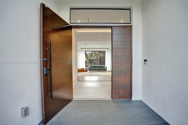 hallway featuring concrete flooring