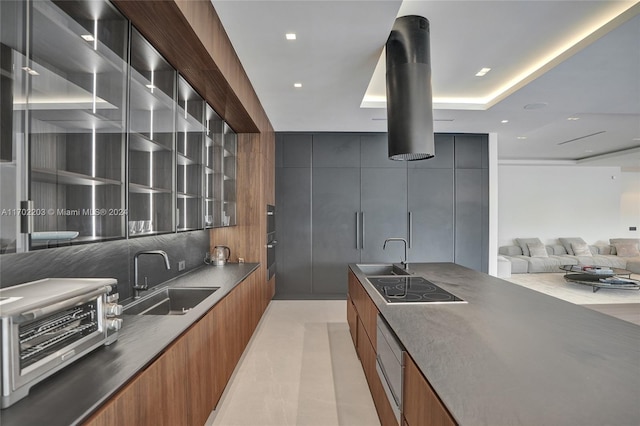 kitchen featuring black electric cooktop and sink