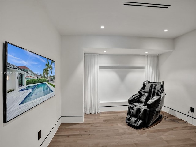 sitting room featuring light hardwood / wood-style flooring