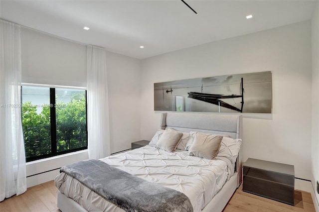 bedroom with light wood-type flooring