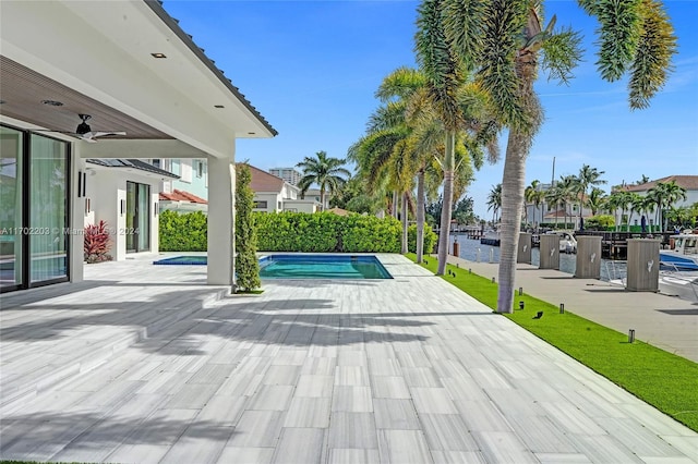 view of pool featuring ceiling fan and a patio area