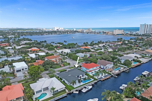 birds eye view of property with a water view