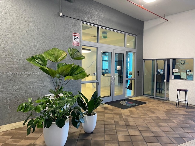 view of exterior entry featuring french doors