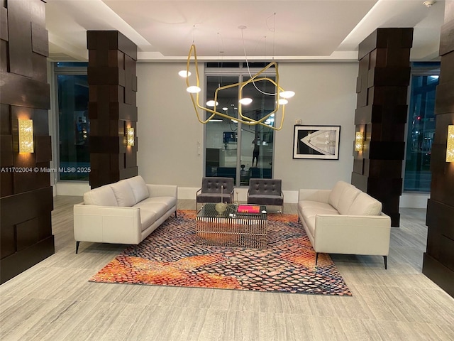 living room with an inviting chandelier