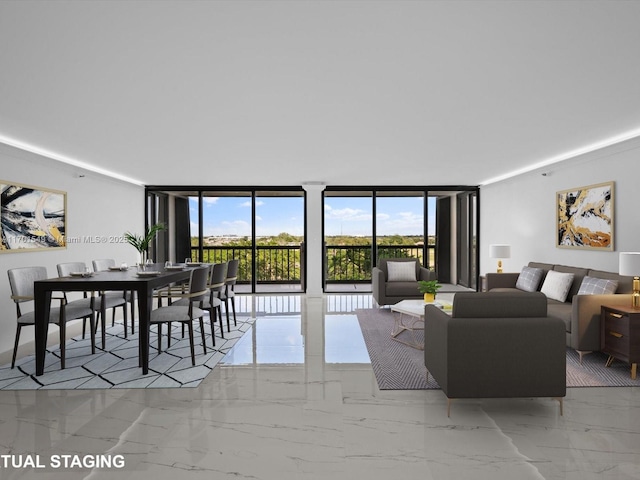 living area with marble finish floor and floor to ceiling windows