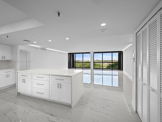 kitchen featuring a center island and white cabinets