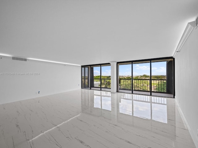 spare room featuring expansive windows