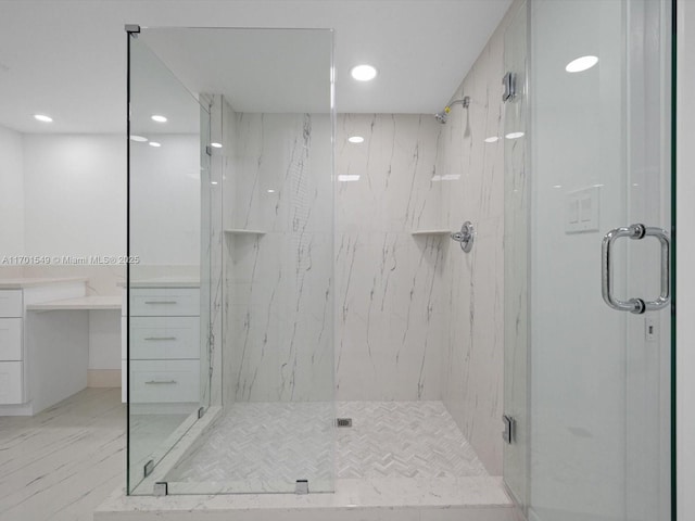 full bathroom featuring marble finish floor, a marble finish shower, and recessed lighting