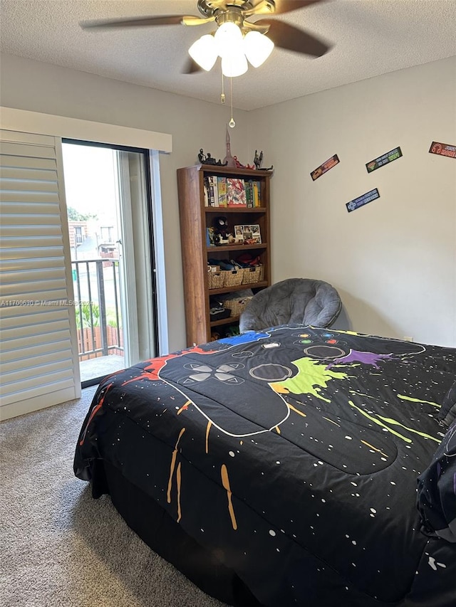 bedroom featuring carpet flooring, access to exterior, ceiling fan, and a textured ceiling