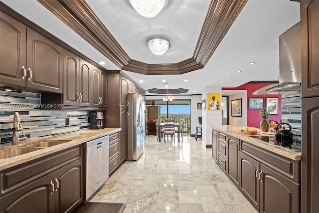 kitchen with decorative backsplash, appliances with stainless steel finishes, dark brown cabinets, and sink