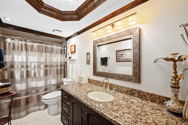 bathroom with toilet, vanity, and crown molding