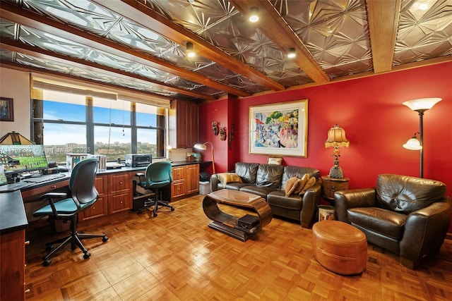 office space with built in desk and light parquet flooring