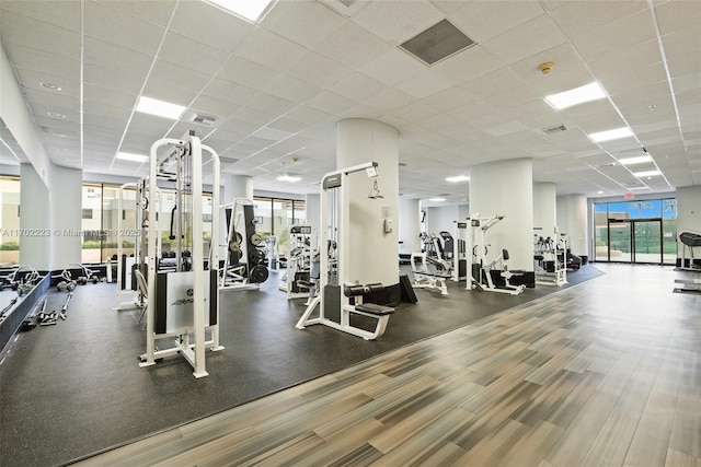 workout area with a drop ceiling