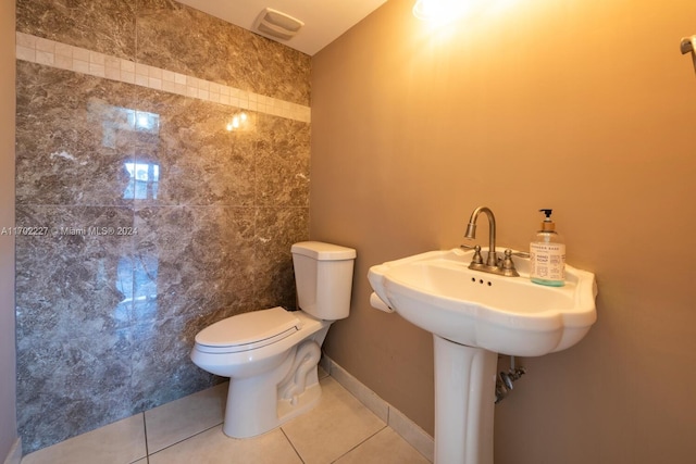 bathroom with tile patterned flooring and toilet