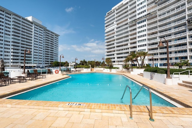 view of swimming pool featuring a patio area