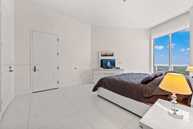 bedroom featuring light tile patterned floors