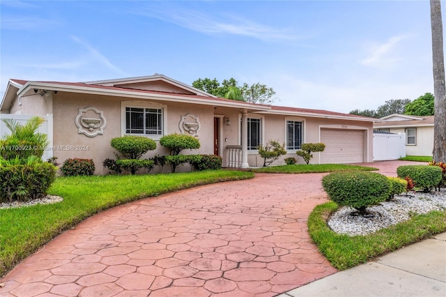 single story home with a garage