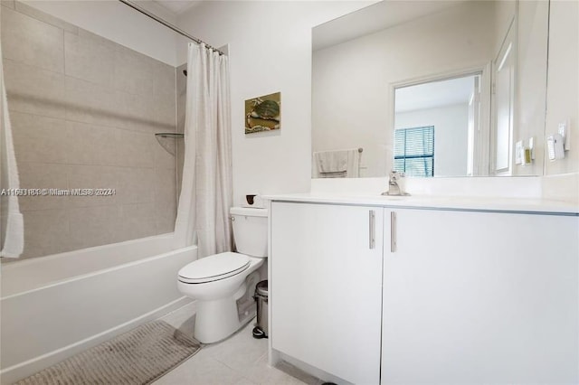 full bathroom featuring tile patterned floors, vanity, toilet, and shower / tub combo with curtain