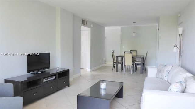 living room with light tile patterned floors