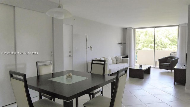 tiled dining room with expansive windows