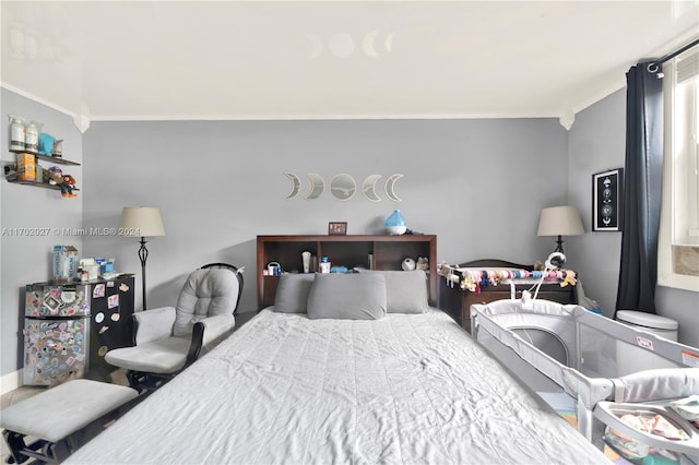 bedroom with crown molding and vaulted ceiling