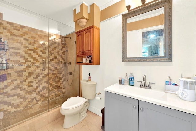 bathroom featuring vanity, toilet, a shower with door, and crown molding