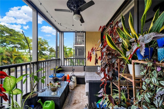 balcony with outdoor lounge area and ceiling fan