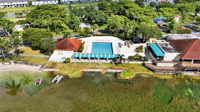 birds eye view of property with a water view