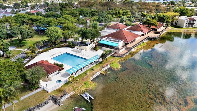 birds eye view of property with a water view