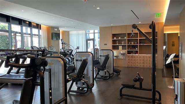 exercise room featuring floor to ceiling windows