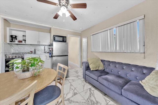 6733 SW 27th Ct, Miramar, FL 33023 - living area featuring light marble finish floors and a ceiling fan